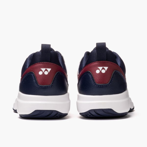 Pair of navy and burgundy sneakers viewed from the rear, white soles, with a logo on the heel.