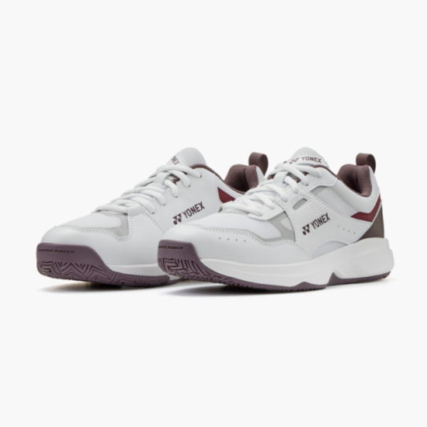 Pair of white Yonex athletic sneakers with lilac accents on a white background, showing side and front views