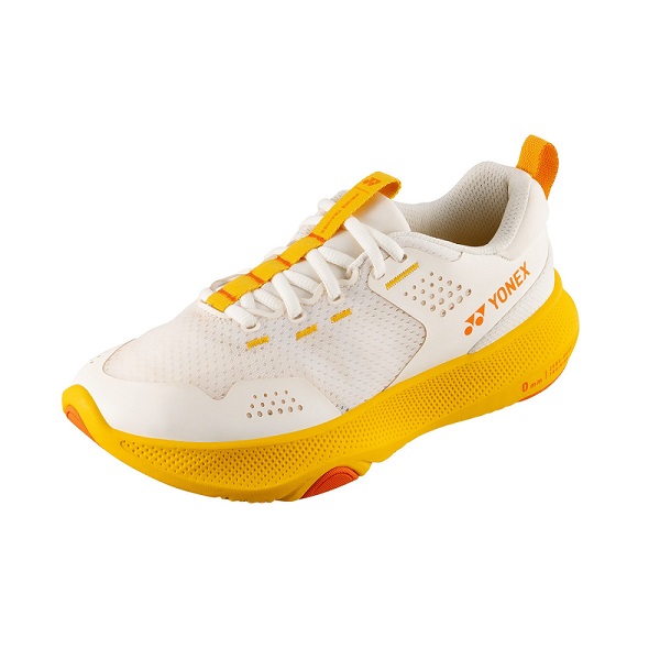 Yonex white and yellow athletic shoe with breathable mesh, lace-up, and yellow outsole.