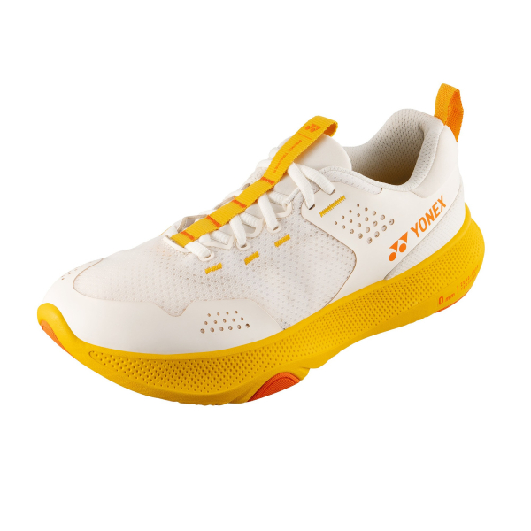 White Yonex athletic shoe with yellow accents and perforated upper, angled to show the sole and laces.