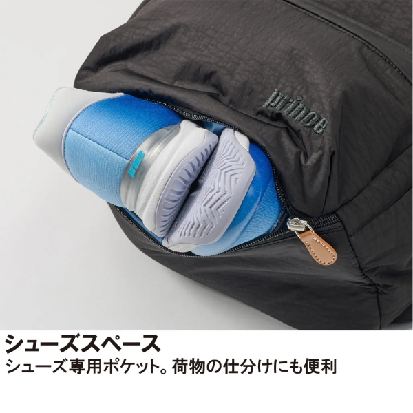 Backpack opened to reveal a dedicated shoe pocket with blue sneakers tucked inside.