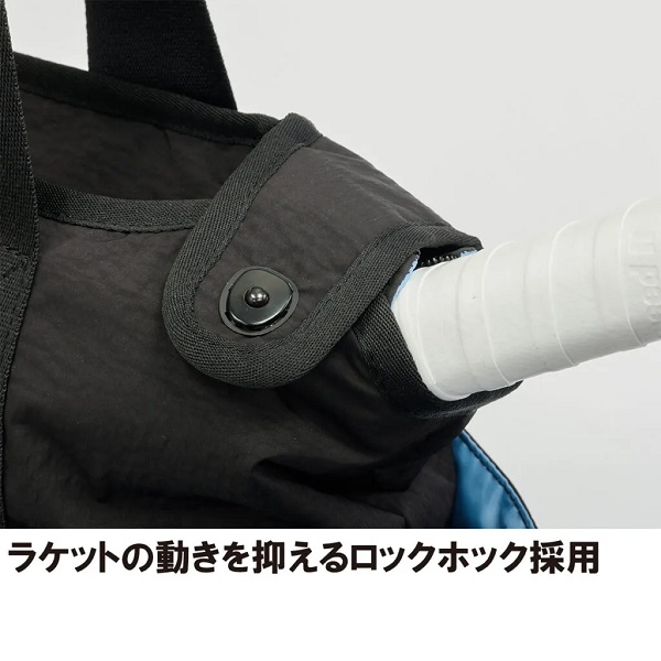 Close-up of a black bag with a strap and a round locking buckle securing a white racket handle sticking out of the bag.