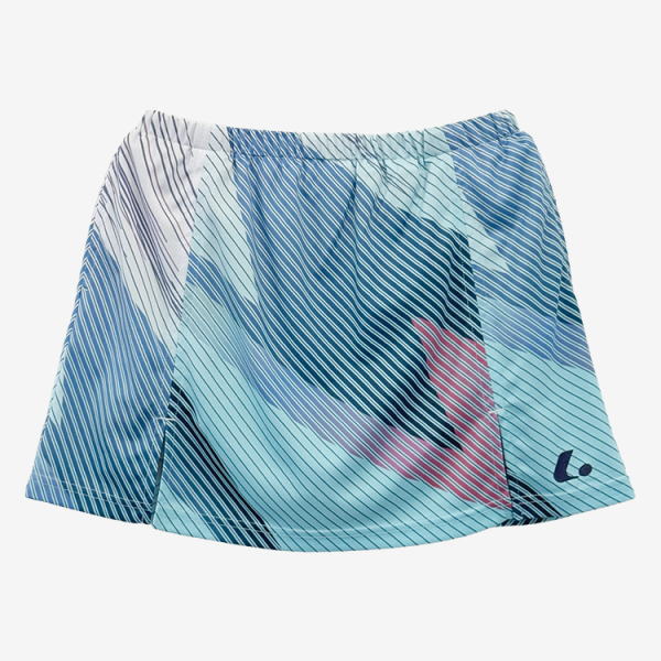 Short, flowy skirt with blue and teal abstract geometric pattern and a small logo near the hem.