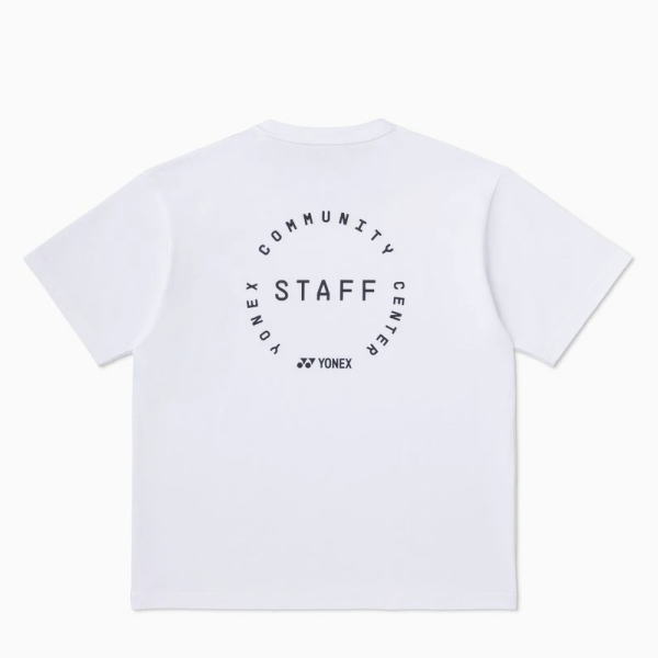 White t-shirt laid flat, back features a circular design reading 'YONEX COMMUNITY CENTER STAFF' with the Yonex logo beneath.