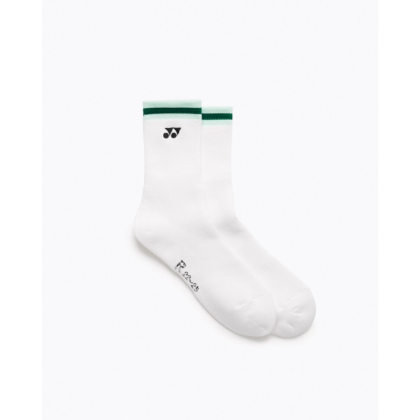 White crew socks with a green top stripe and small black brand logo, shown on a white background at an angle to display the cuff and toe edges.