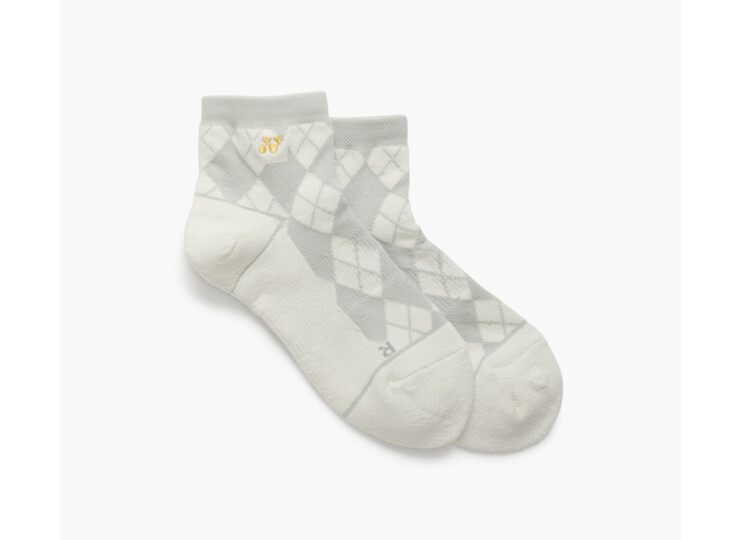 Light gray argyle socks with a diamond pattern and a small gold emblem on the cuff, on a white background.