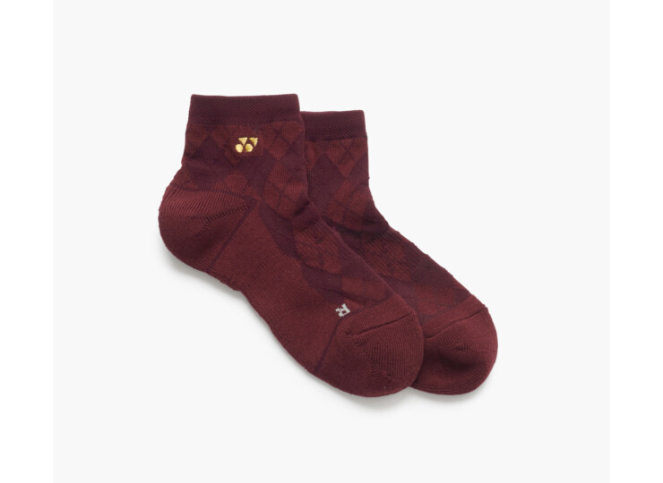 Maroon ankle socks with a subtle argyle pattern and a small gold logo on the cuff.