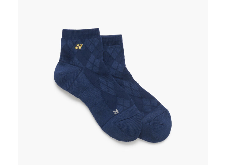 Pair of navy blue argyle-patterned ankle socks with a small gold logo on the side