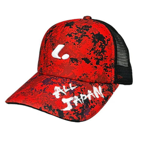 Red and black camo-patterned trucker cap with white 'I' logo on the front and 'I AM JAPAN' lettering on the brim; black mesh back.
