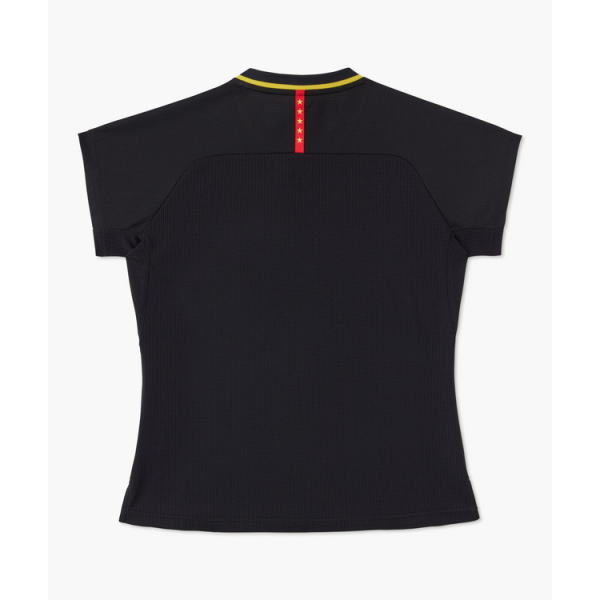 Back view of a black short-sleeve sports shirt with a yellow-trimmed collar and a red vertical stripe with stars down the center back.