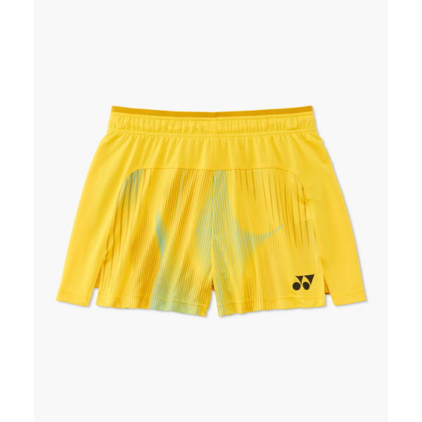 Bright yellow athletic shorts with an abstract blue-green pattern on the back panel, elastic waistband, Yonex logo at the lower right.