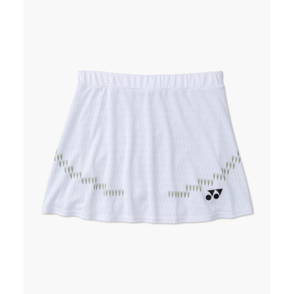 White tennis skirt with a zigzag row of small green triangles along the hem and a Yonex logo at the bottom-right corner.
