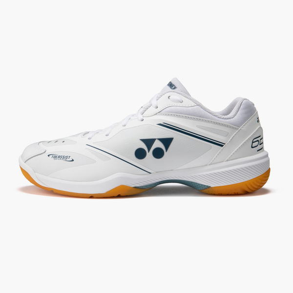 White athletic sneaker with a blue Yonex logo, side view, and orange outsole viewed from the left