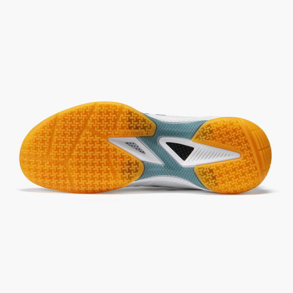 Bottom view of a running shoe with a bright orange outsole and teal/white midsole for grip and stability.