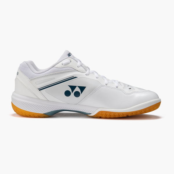 White tennis shoe with a blue Yonex logo and orange outsole, side view for product display.