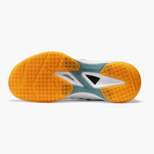 Bottom view of a running shoe with orange outsole, teal midsole, and white details.
