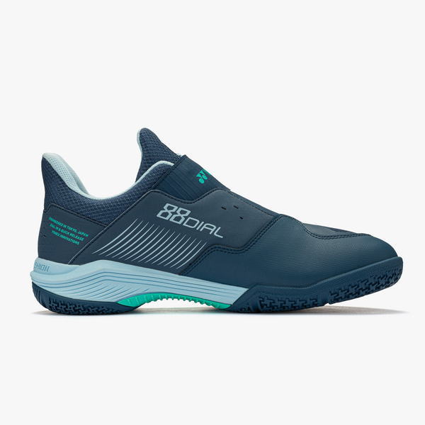 Navy blue athletic sneaker shown in a side profile with light blue midsole and teal accents for a running shoe product. - Product image: navy blue sport shoe with teal outsole highlight and stitched detailing on the side.