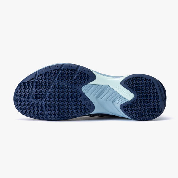 Bottom view of a blue athletic shoe sole with textured grip patterns.