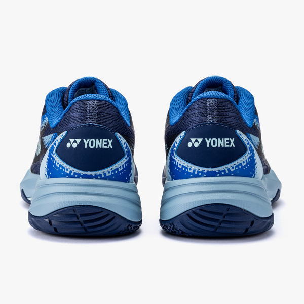 Pair of blue Yonex running shoes seen from the back, with light-blue midsoles and dark navy uppers.