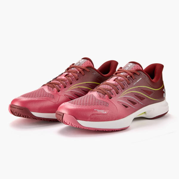 Pair of pink running shoes with lime-yellow side accents and a white midsole on a white background.