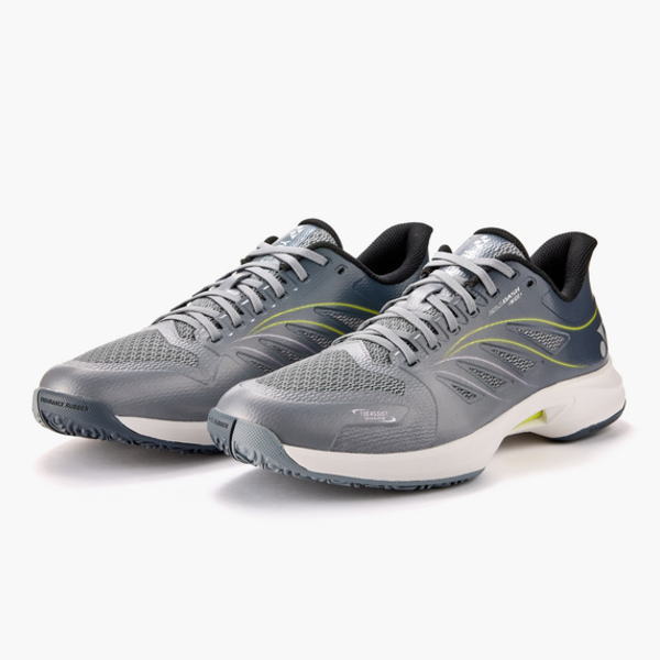Pair of gray running shoes with lime-green accents and white soles on a white background.