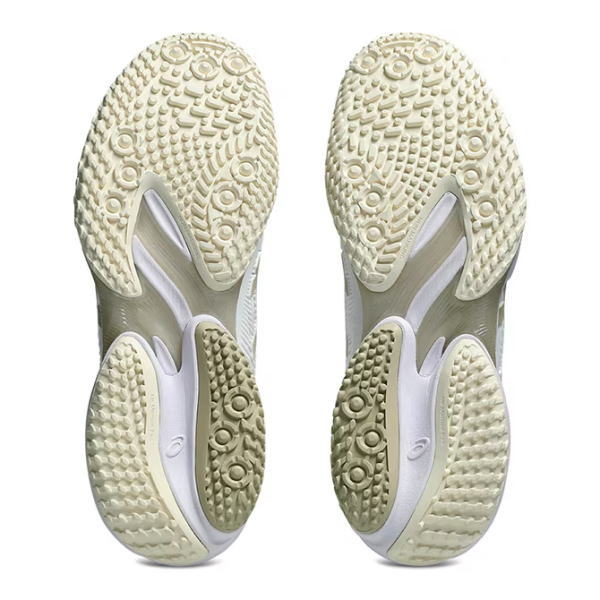 Bottom view of a pair of light-colored running shoes showing their tread patterns and outsole textures.