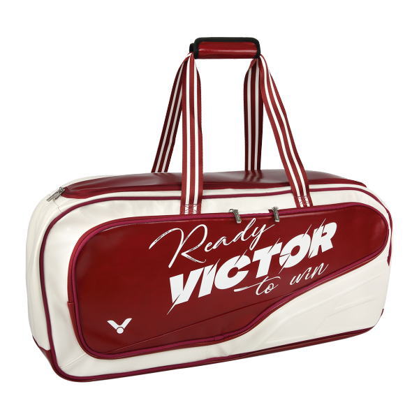 White and maroon tennis duffel bag with striped handles and a large front pocket logo reading 'Ready to win'