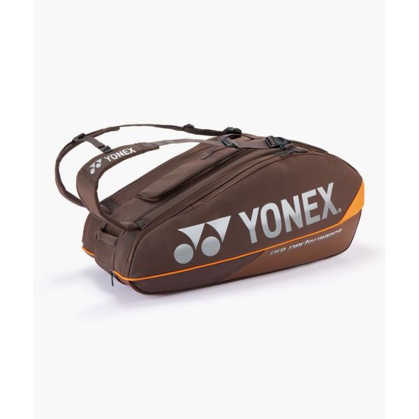 Brown Yonex sports bag with orange trim and white Yonex logo, designed for tennis or badminton gear.