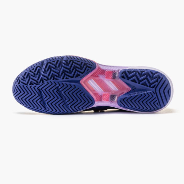 Bottom view of a blue and purple athletic shoe sole with chevron zigzag tread and pink midfoot area.