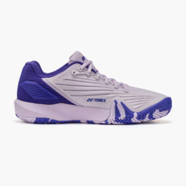 White and purple Yonex tennis shoe shown in side profile with blue sole and branding on the midfoot area.