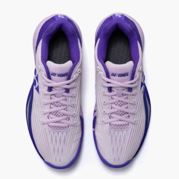 Top-down view of a pair of light purple Yonex athletic shoes with pink laces and purple inner lining, shown from above.
